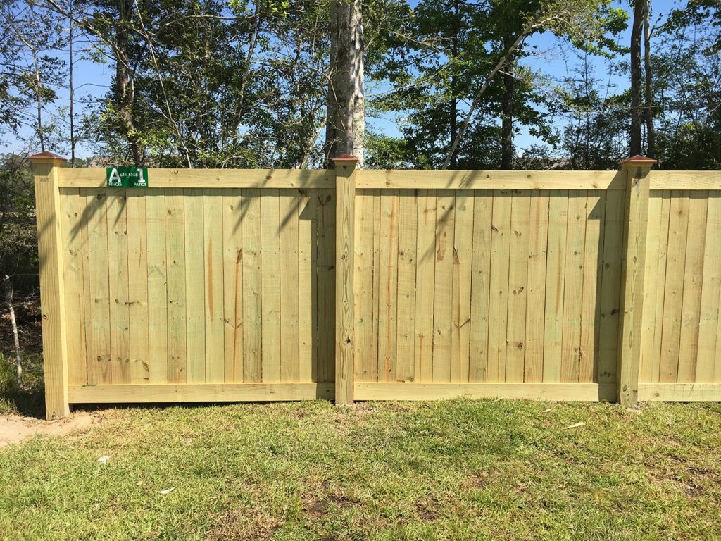 framed fence with copper post caps | A-1 Fence Company